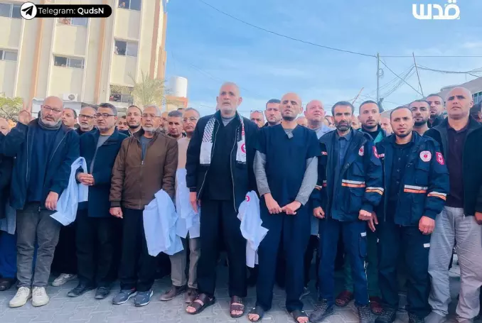 Heroic medical staff stand tall alongside the police force outside the Maamadani Hospital. (Photo: via QNN)